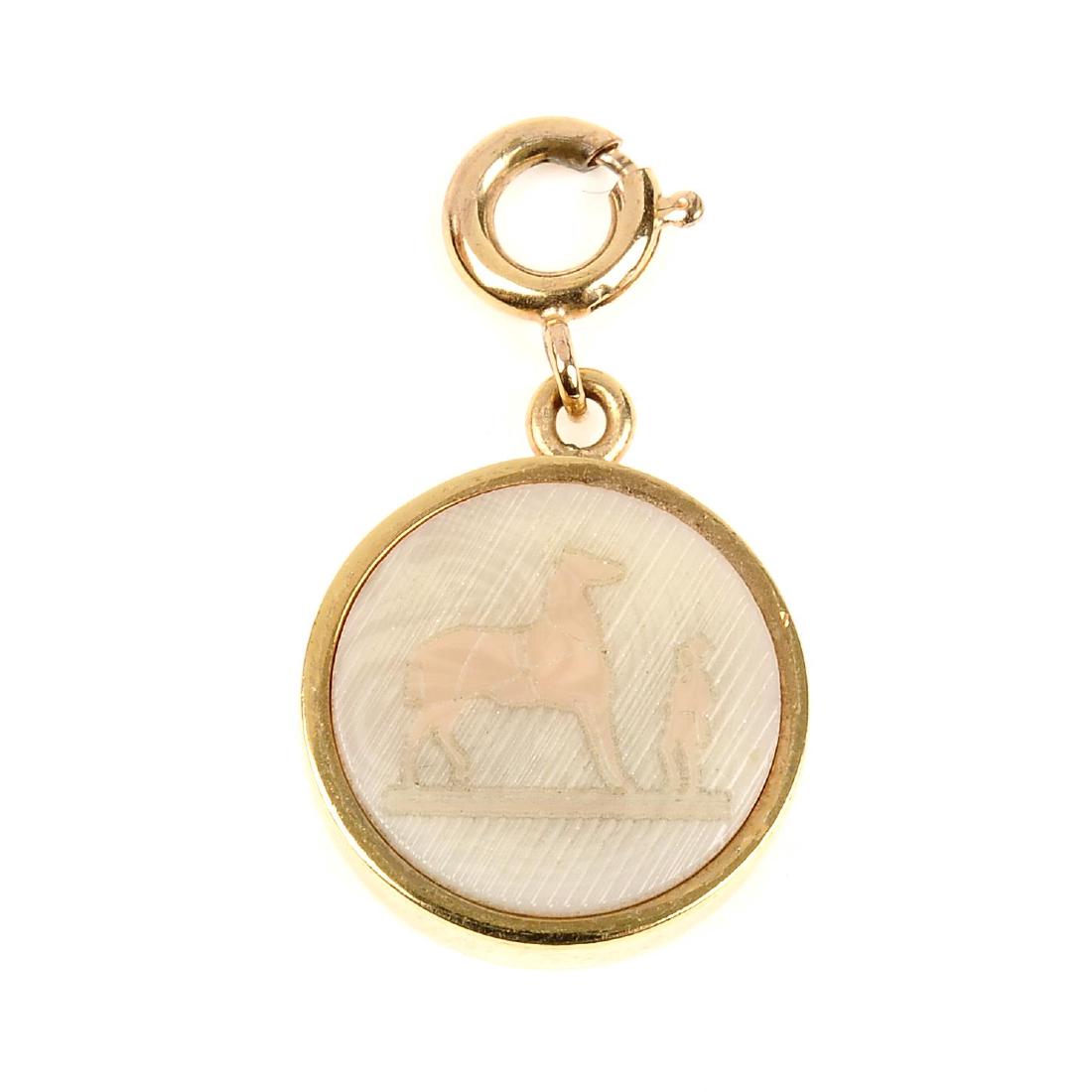 HERMÈS - a carved Intaglio charm. The small gold-tone (1 of 3)