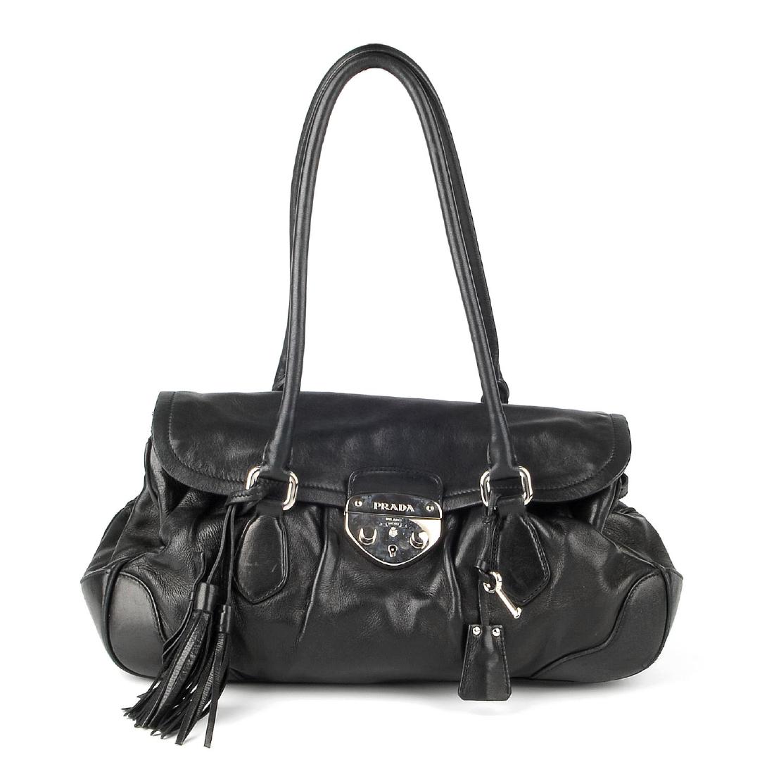 PRADA - a black leather Pushlock Tassel Flap handbag. (1 of 5)