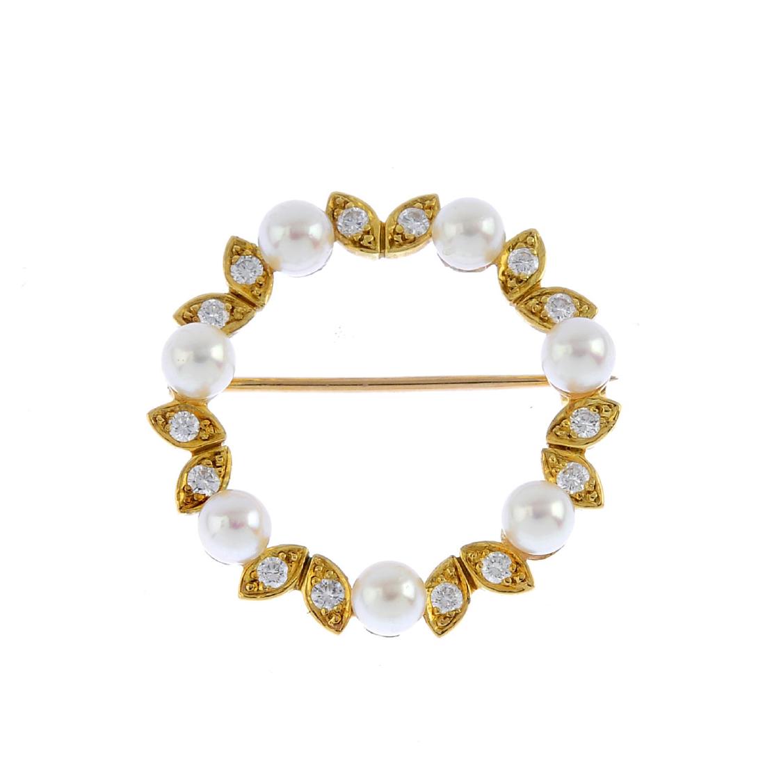 An 18ct gold cultured pearl and diamond brooch. (1 of 2)