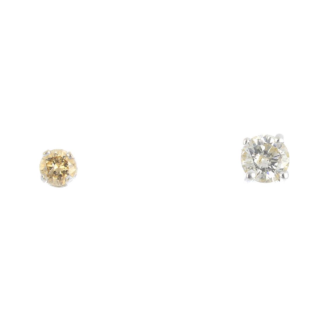 Two single brilliant-cut diamond stud earrings. (1 of 3)