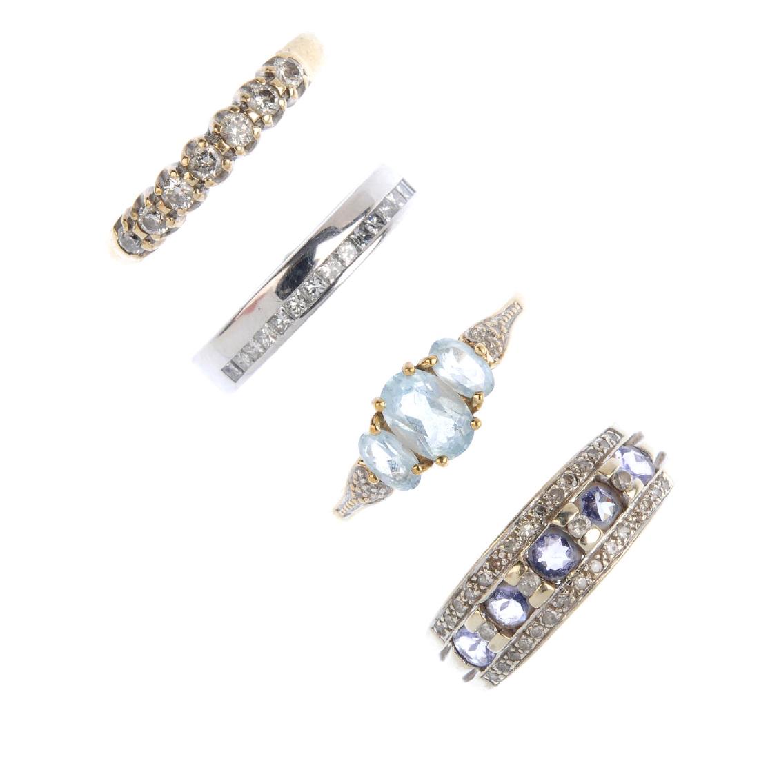 Four 9ct gold diamond and gem-set rings. To include a (1 of 2)