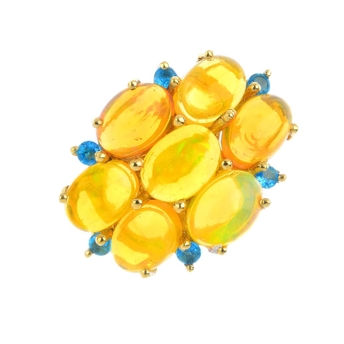 A 9ct gold opal and gem-set ring. The oval opal (1 of 4)