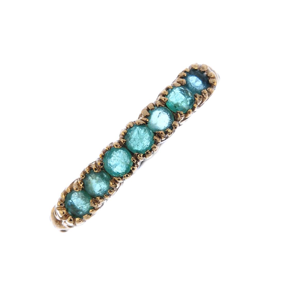 A 9ct gold emerald half eternity ring. The (1 of 4)