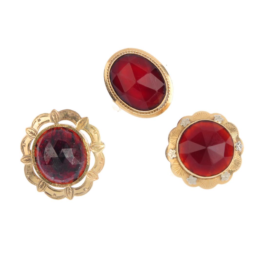 Two carnelian rings and a garnet brooch. To include a (1 of 2)