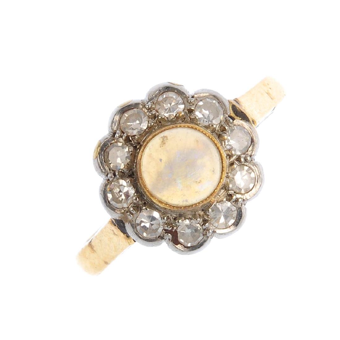 An opal and diamond cluster ring. The circular opal (1 of 3)