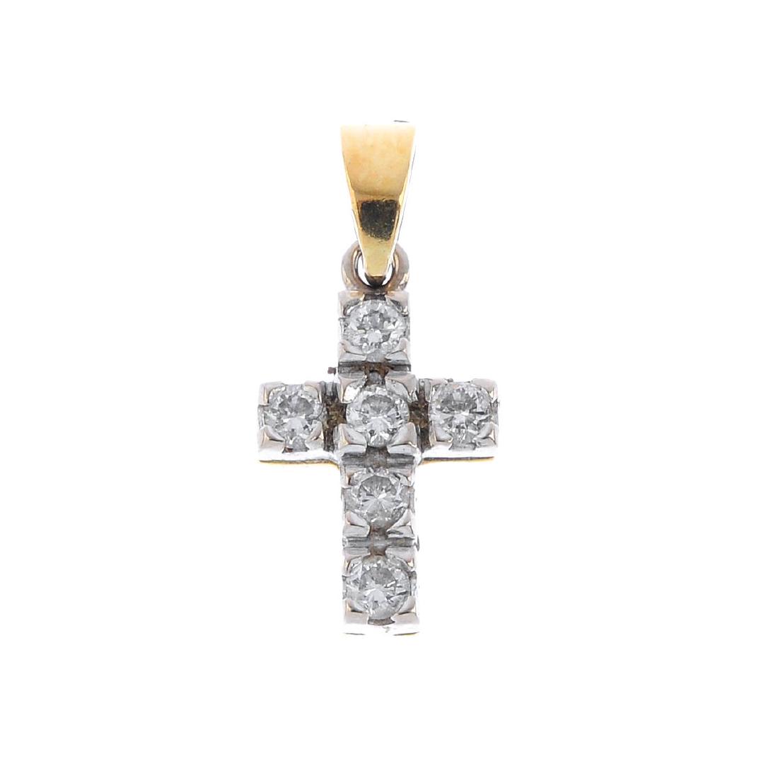 An 18ct gold diamond cross pendant. The brilliant-cut (1 of 2)