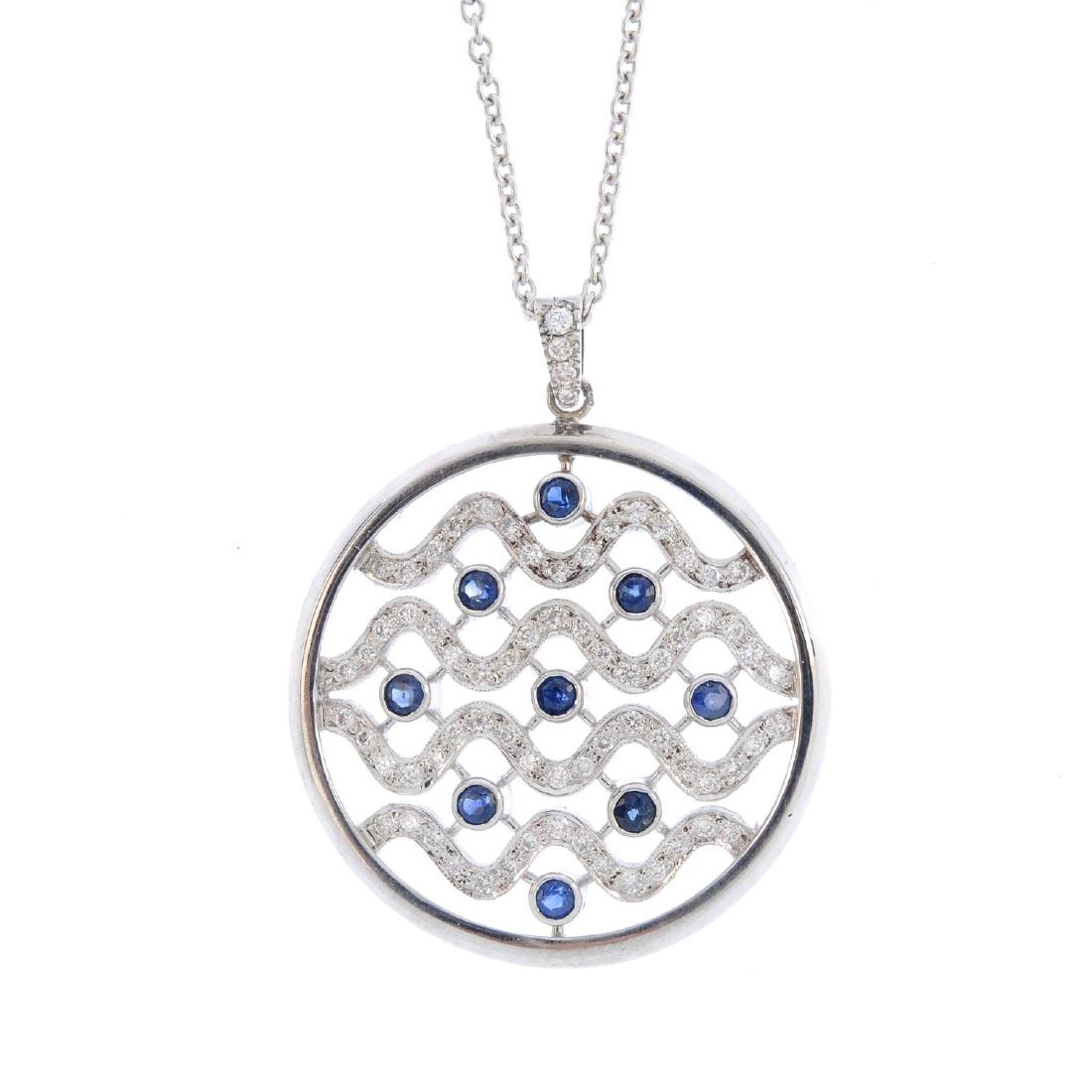 A diamond and sapphire pendant. Of circular outline, (1 of 3)