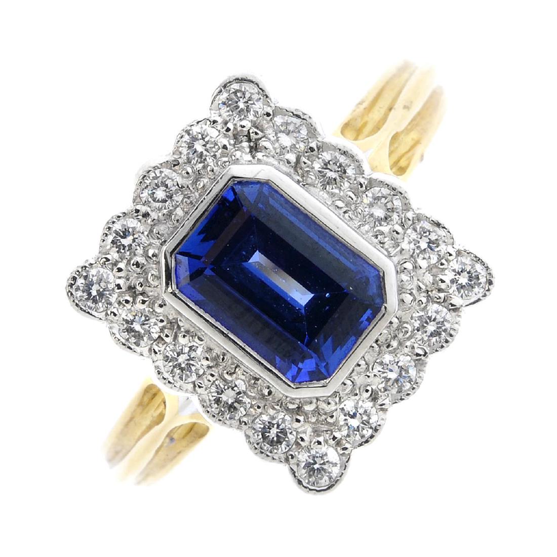 An 18ct gold sapphire and diamond cluster ring. The (1 of 3)