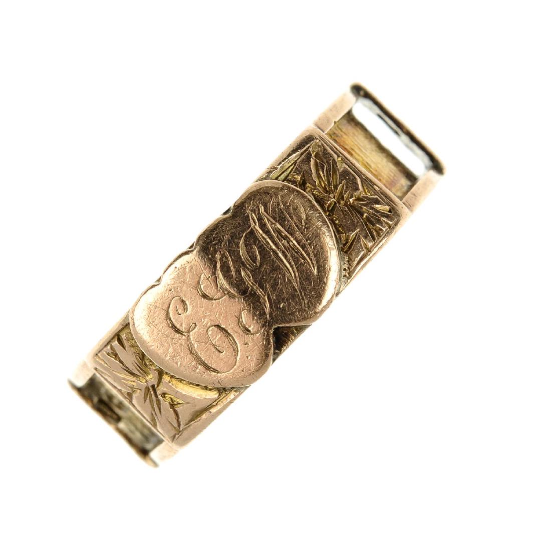 An Edwardian 9ct gold memorial ring. With two applied (1 of 4)