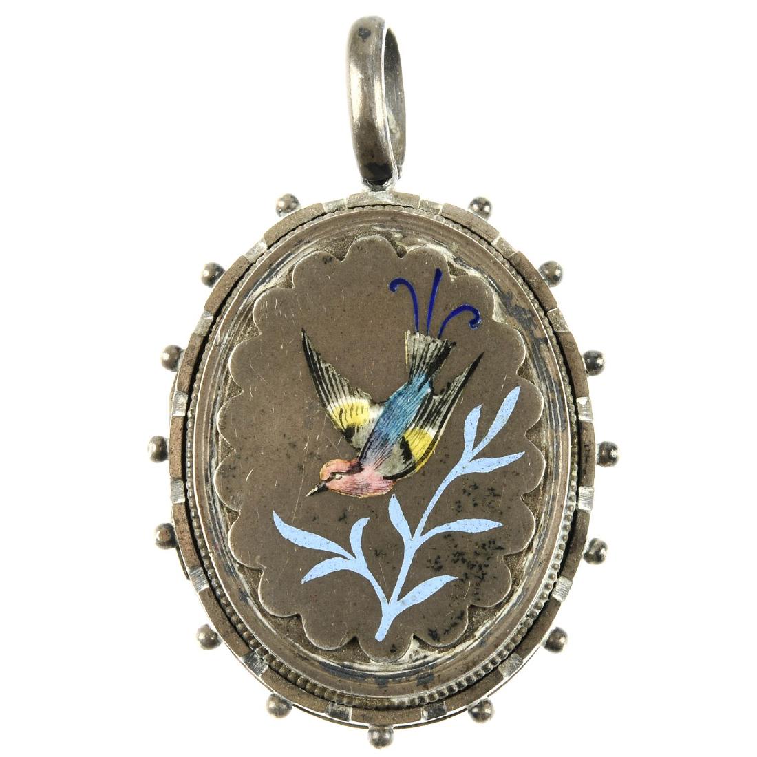 A late Victorian silver and enamel locket. Of oval (1 of 2)