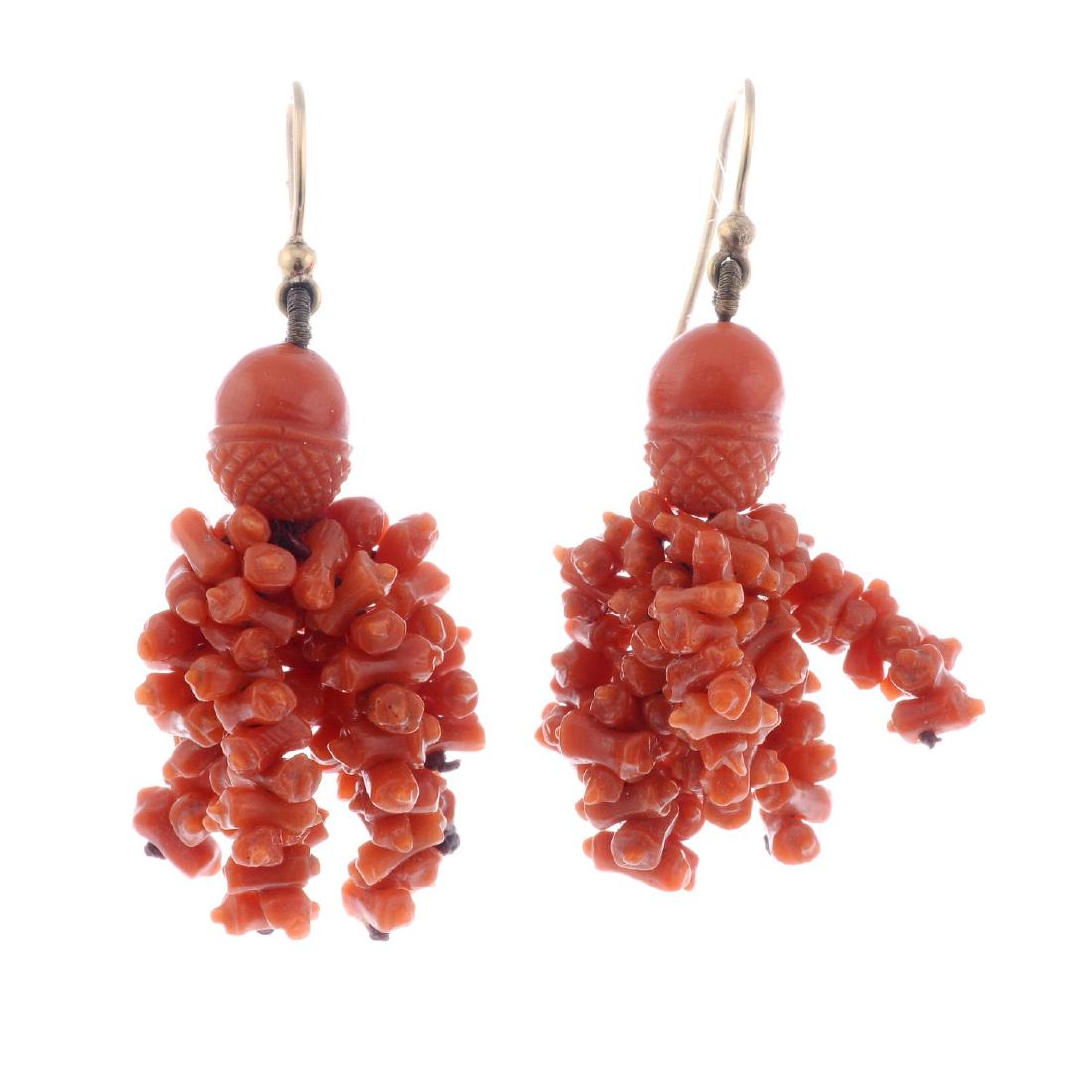 A pair of coral earrings. Designed as ear hooks, with (1 of 2)