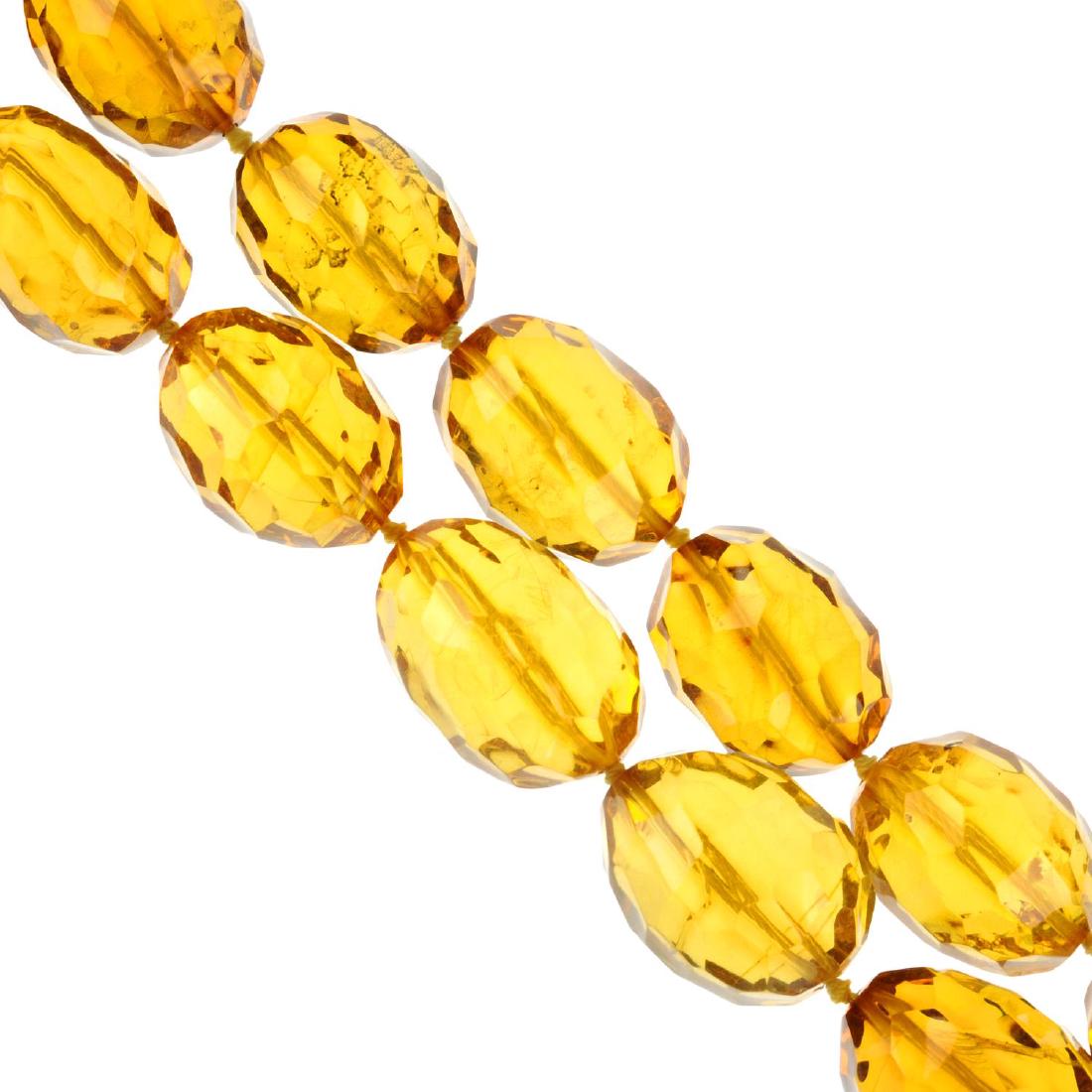 A faceted natural amber necklace. The graduated beads (1 of 2)