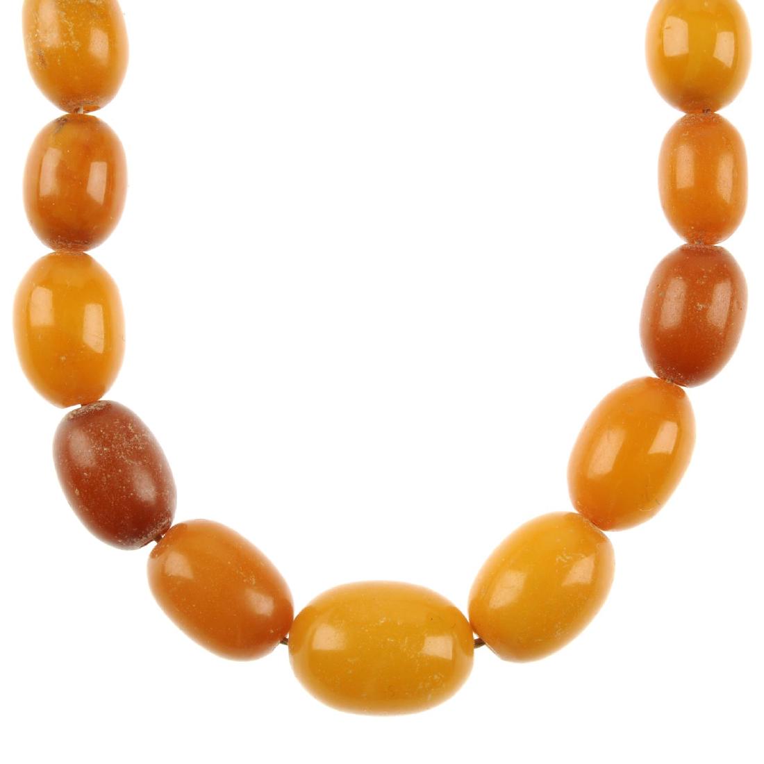 A natural amber bead necklace. Designed as graduated (1 of 2)