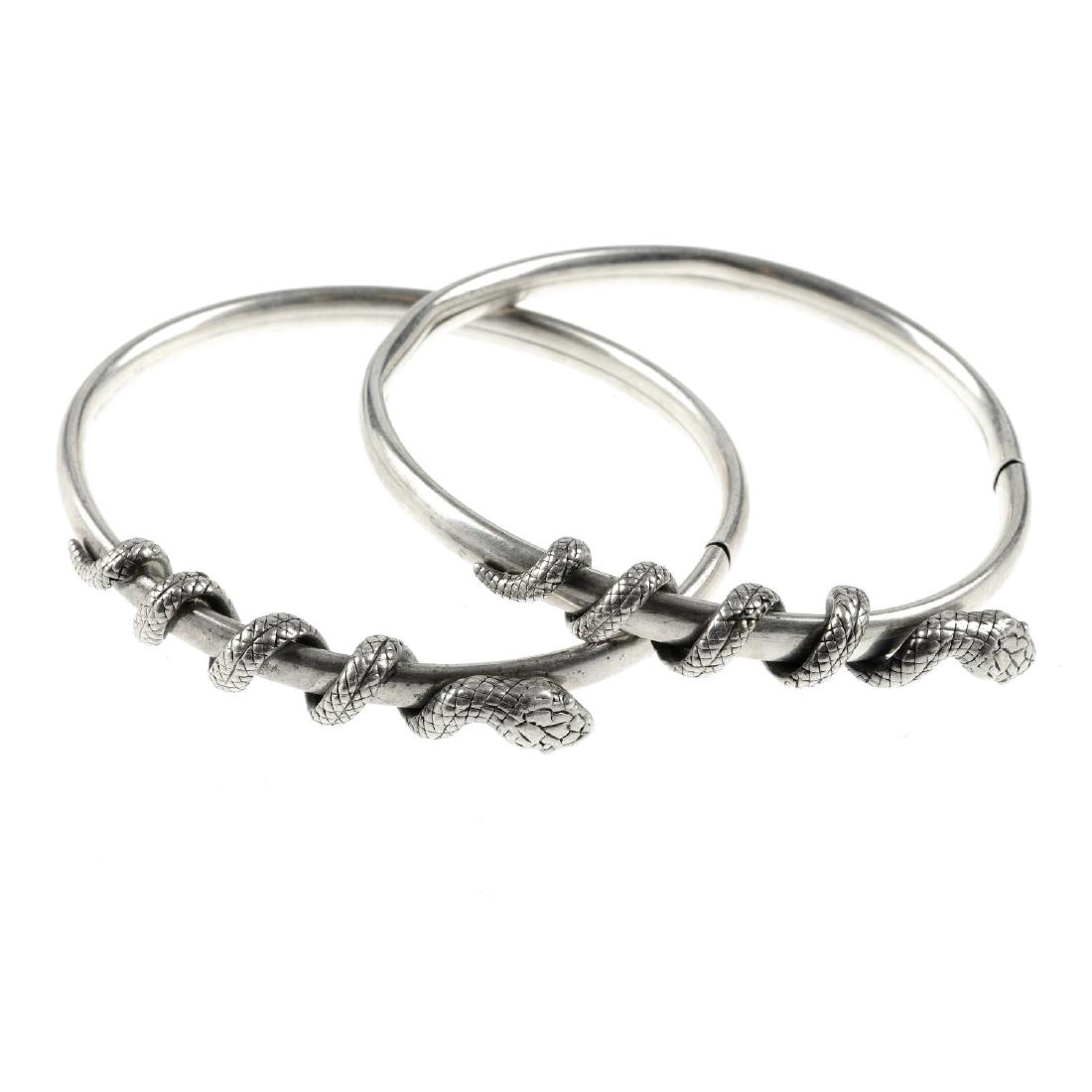 A selection of silver and white metal bangles. To (1 of 2)