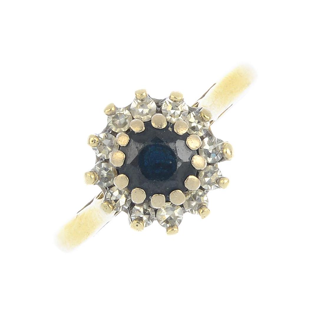 An 18ct gold sapphire and diamond cluster ring. The (1 of 4)