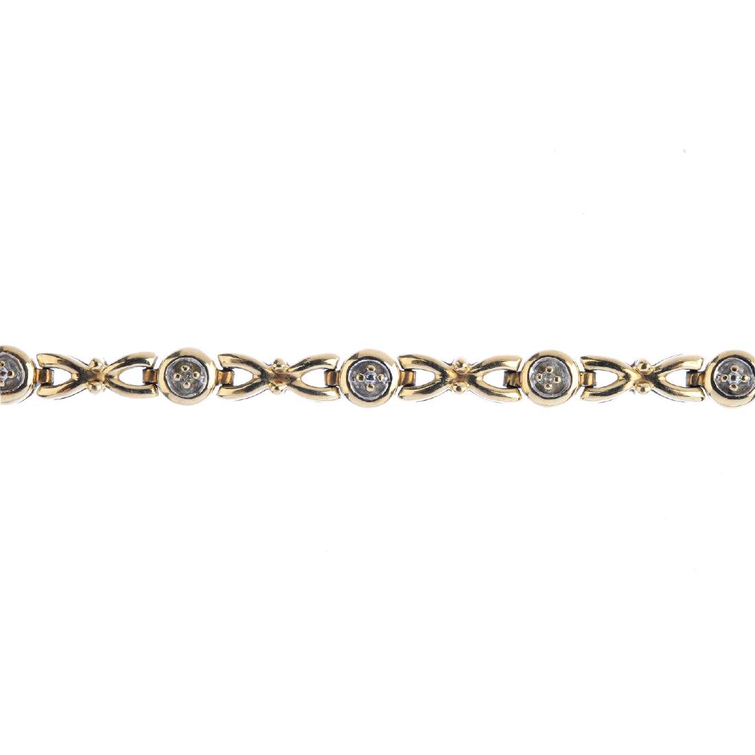 A 9ct gold diamond bracelet. Designed as a series of (1 of 2)