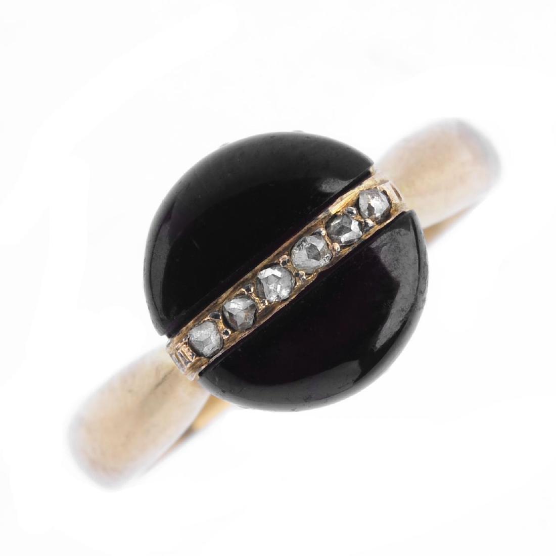 A garnet and diamond ring. Of circular outline, the (1 of 4)