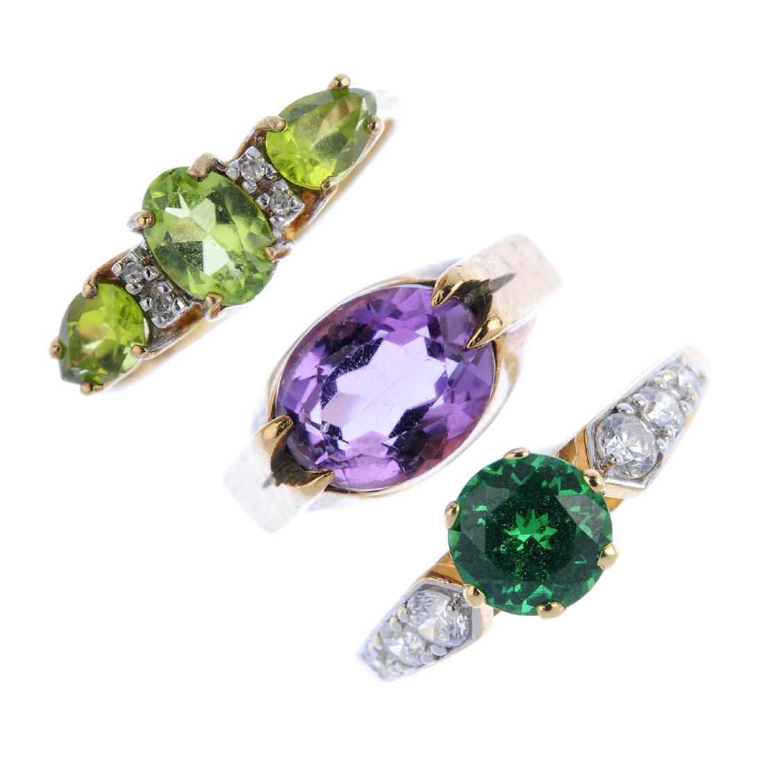 Three gold gem-set rings. To include a 9ct gold peridot (1 of 3)