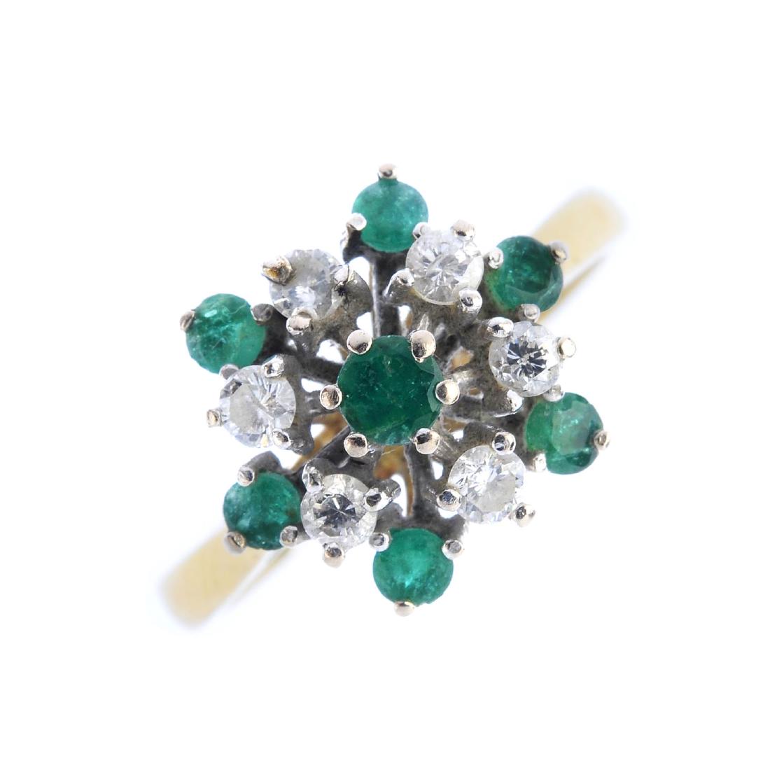 An 18ct gold emerald and diamond cluster ring. The (1 of 4)