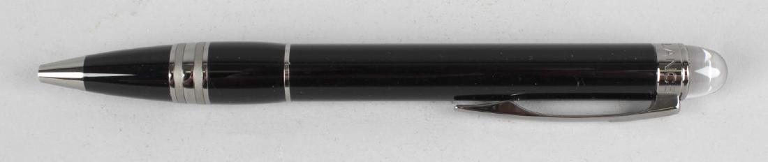 A Montblanc Starwalker ballpoint pen, the black resin: A Montblanc Starwalker ballpoint pen, the black resin body with chrome coloured clip and banding, having floating Montblanc white star emblem terminal, 5.5 (14cm) long, in fitted maker's case and card