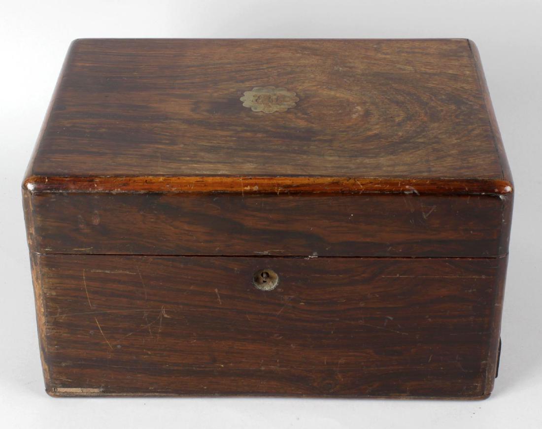 Five assorted 19th century rosewood jewellery boxes.: Five assorted 19th century rosewood jewellery boxes. Each in hinged rectangular form with tray insert, largest 12 x 8.5 x 7 high, (30.5cm x 21.5cm x 18cm), (5).