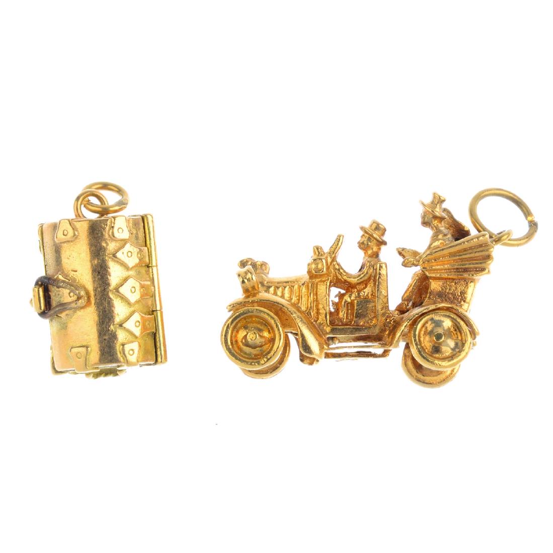 Two 9ct gold charms. The first designed as a hinged (1 of 2)