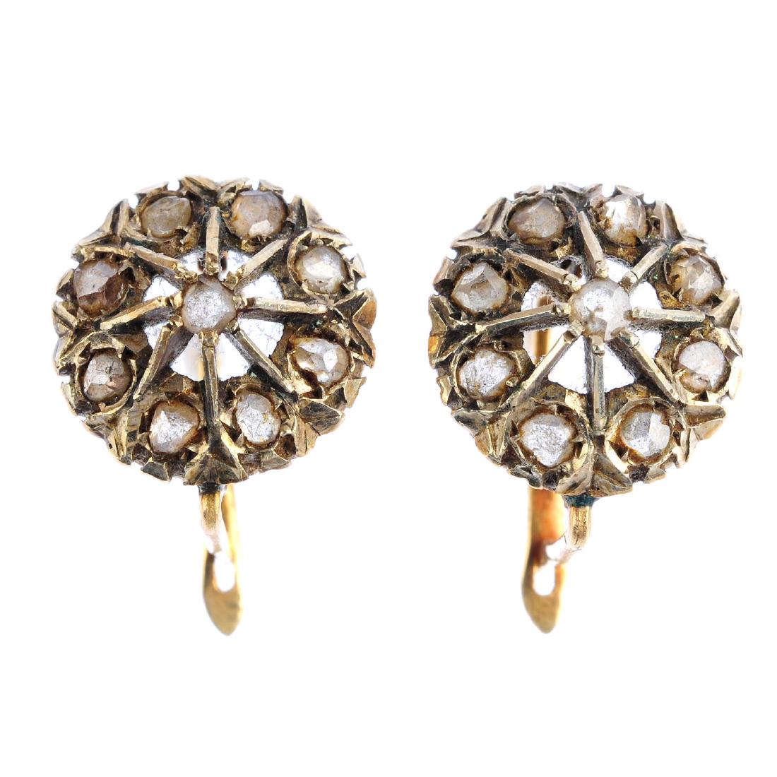 A pair of diamond cluster earrings. Each designed as a (1 of 2)