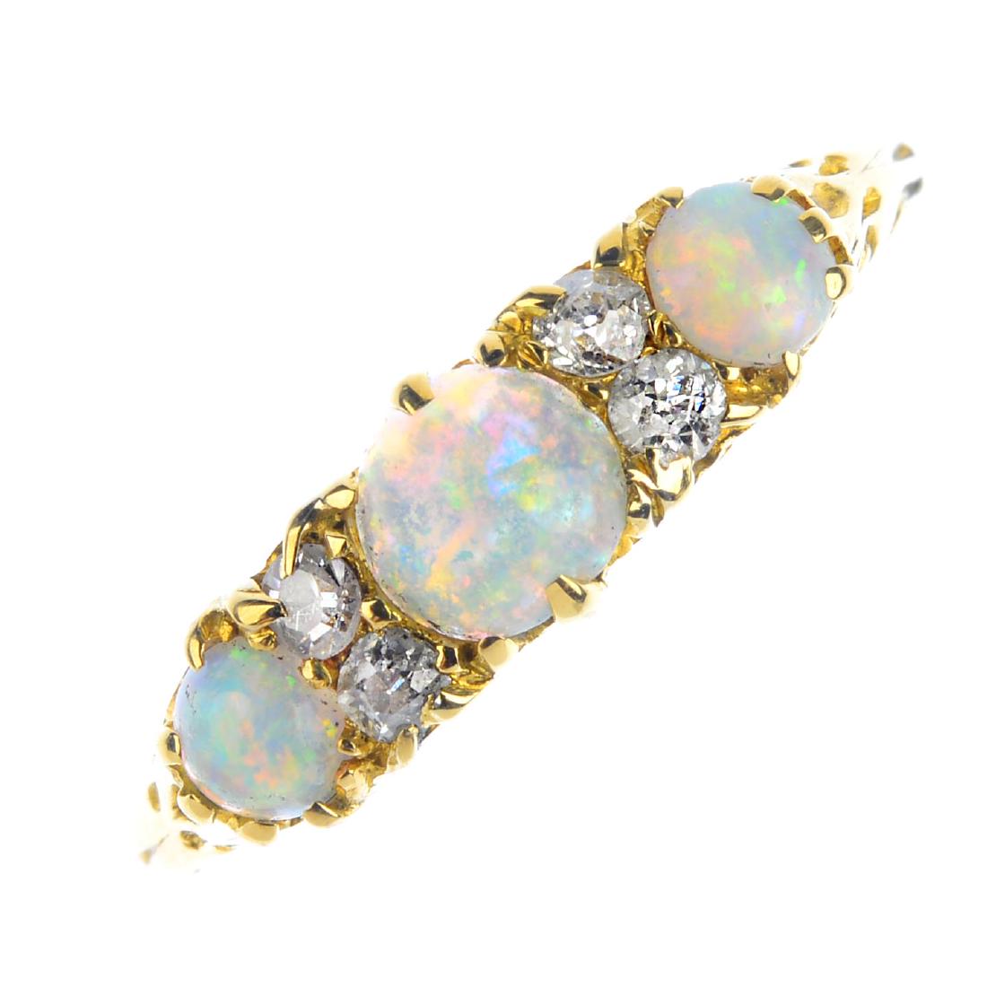 An opal three-stone and diamond ring. The graduated (1 of 3)