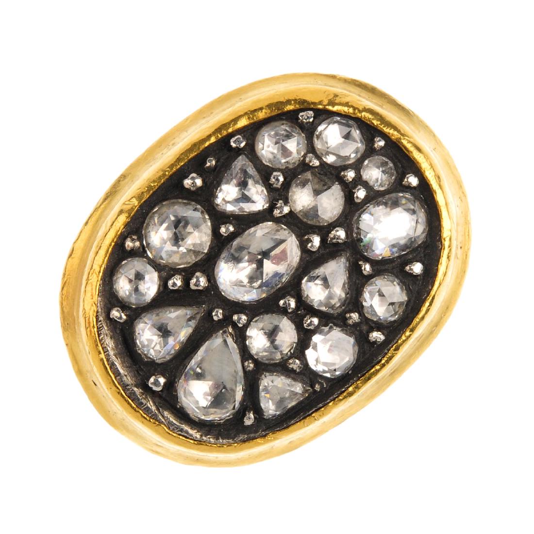 A diamond cluster ring. Of bi-colour design, the (1 of 3)