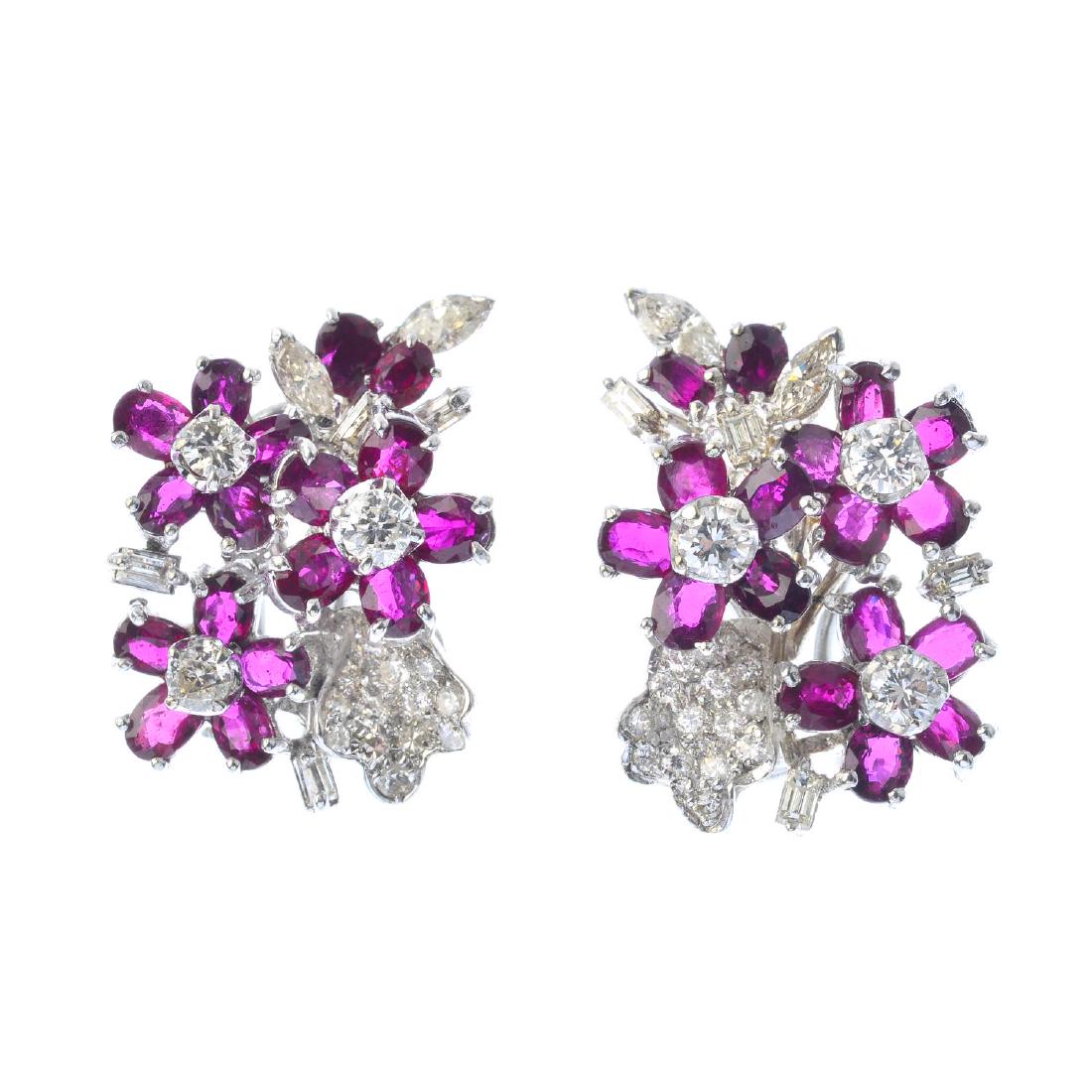 A pair of ruby and diamond earrings. Each designed as a (1 of 1)