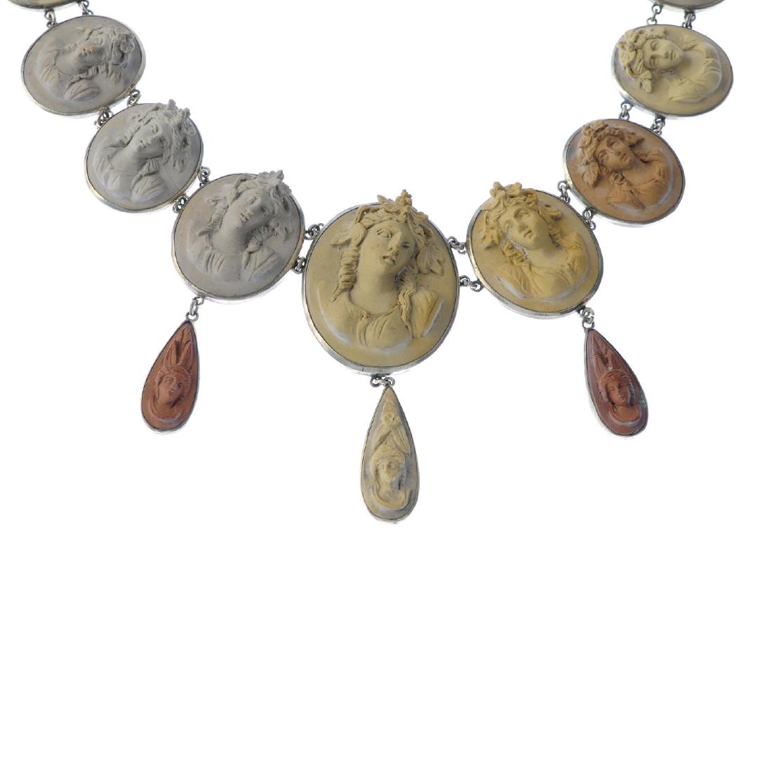 A mid Victorian lava cameo necklace. Comprising (1 of 3)