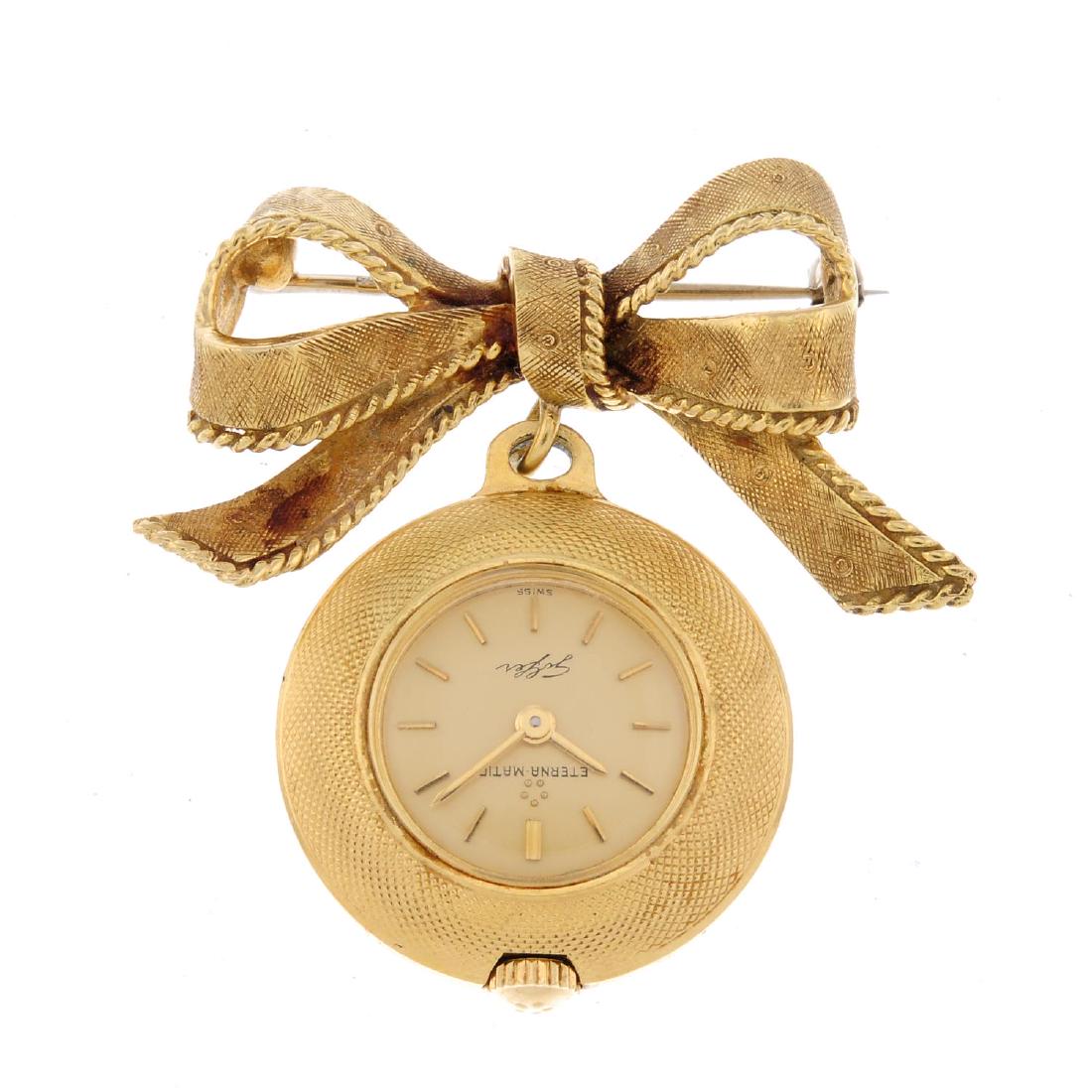 An open face pendent watch by Eterna. Yellow metal case (1 of 2)