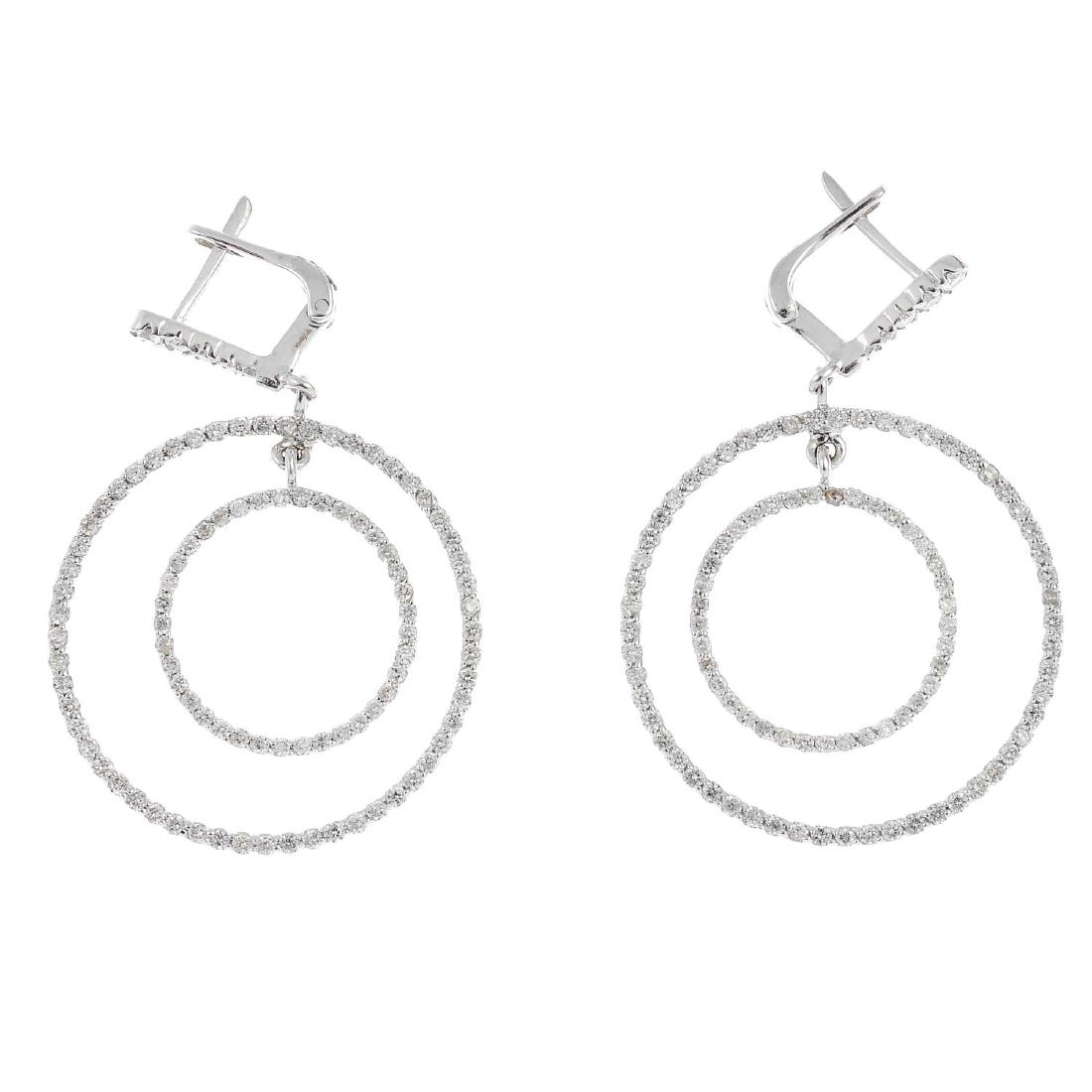 A pair of diamond earrings. Each designed as two (1 of 1)