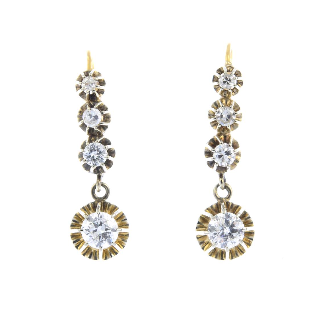 A pair of diamond earrings. Each designed as a: A pair of diamond earrings. Each designed as a circular-cut diamond drop, suspended from a graduated brilliant and single-cut diamond line. Estimated total diamond weight 1ct, H-I colour, P1 clarity. 