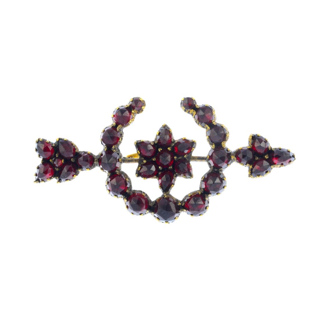 A late Victorian garnet brooch. Designed as an arrow (1 of 2)