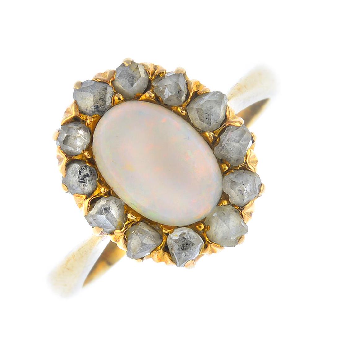 An opal and diamond cluster ring. The oval opal (1 of 3)