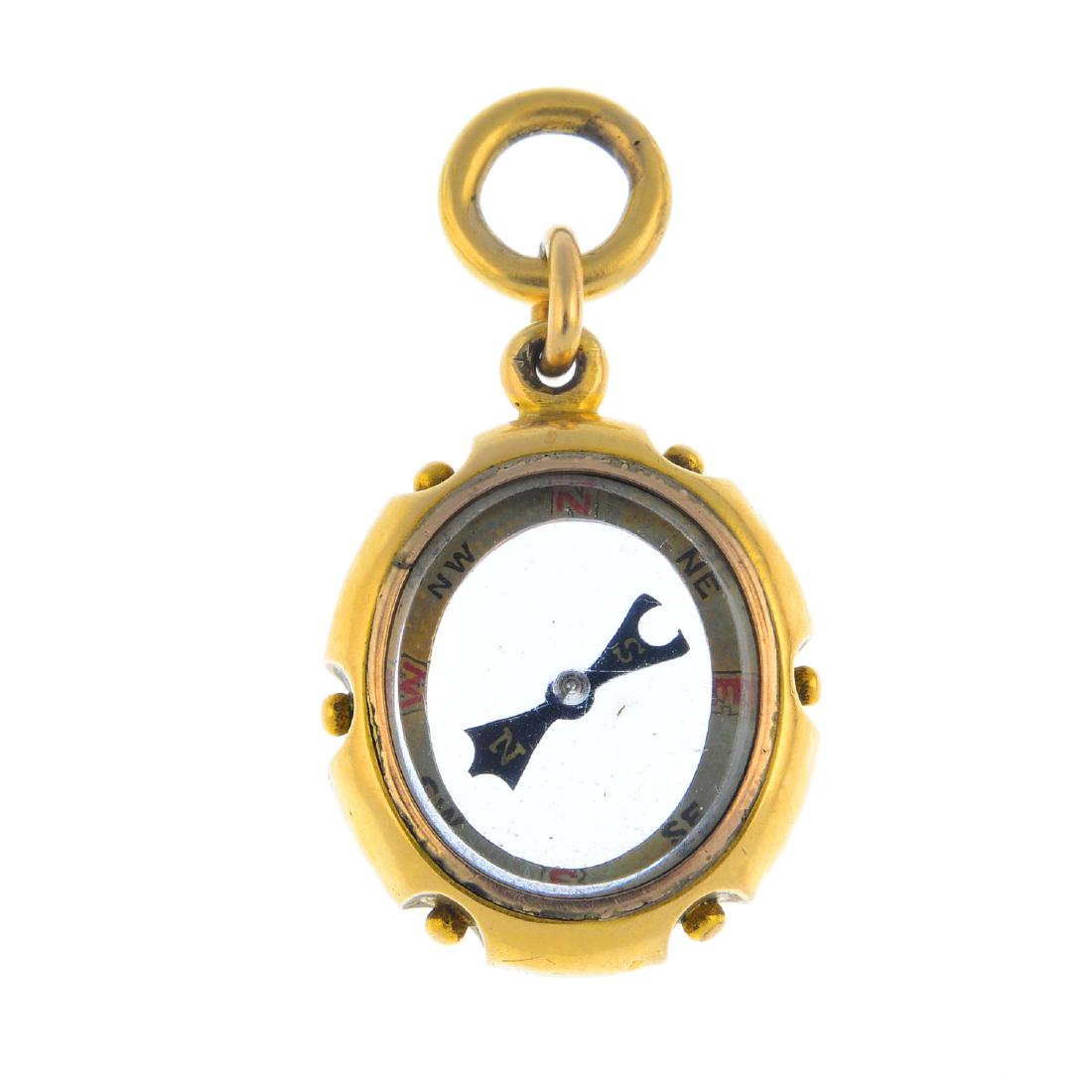 A late Victorian 18ct gold compass fob. Of oval (1 of 2)