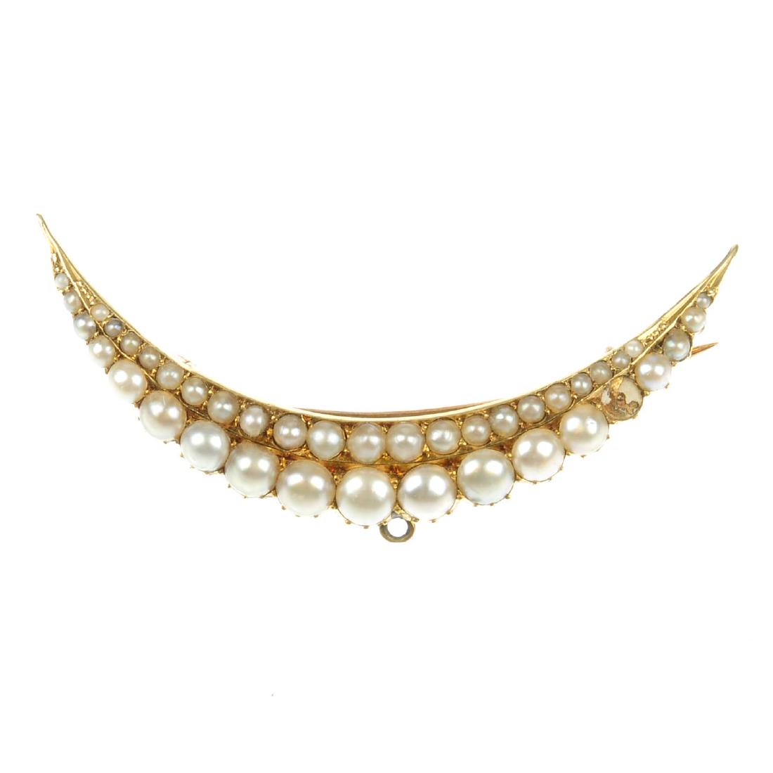 A split pearl brooch. Of crescent shape, designed as (1 of 2)