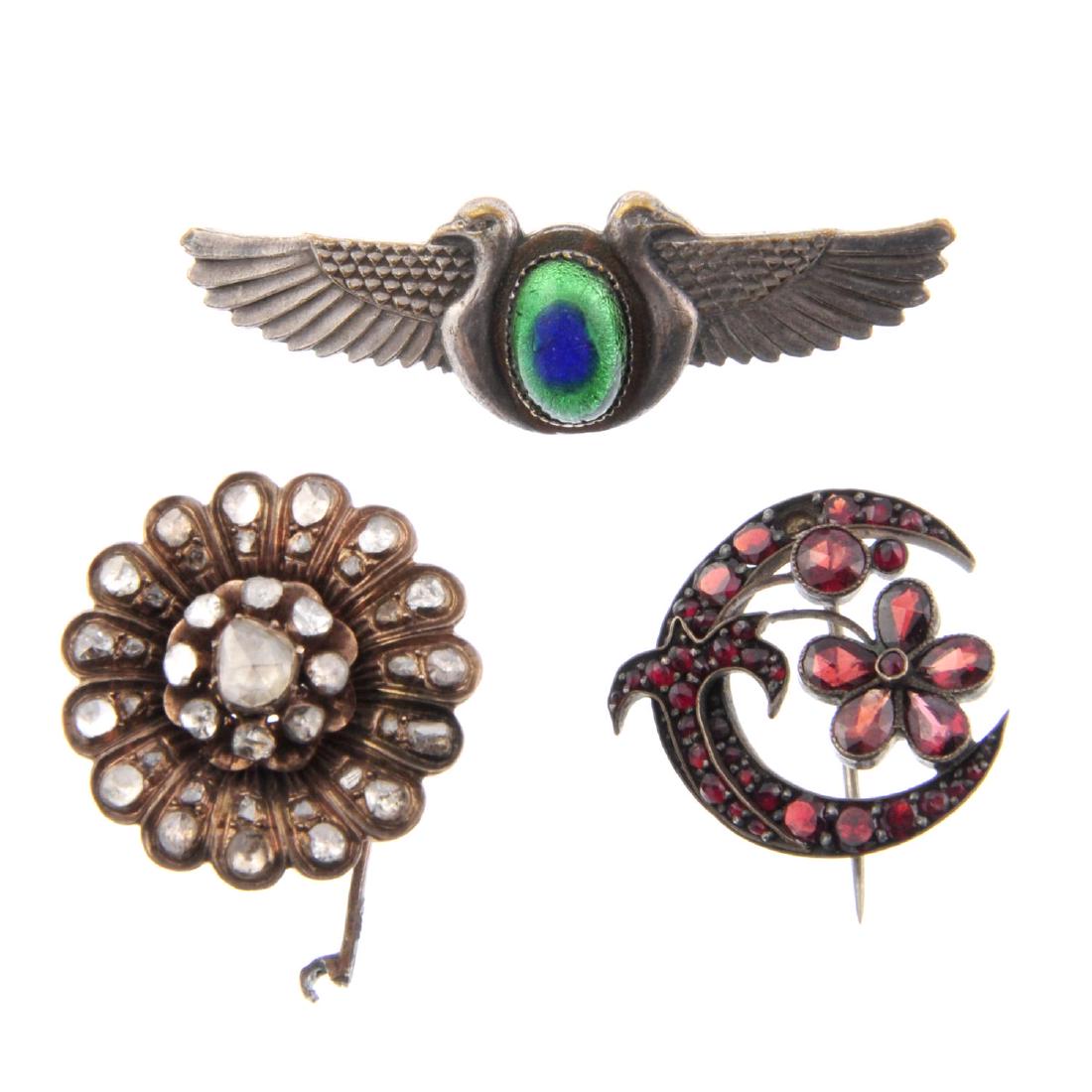 A selection of early 19th to early 20th century: A selection of early 19th to early 20th century jewellery. To include an en tremblant flower section of jewellery set with rose-cut diamonds, a small Bernard Instone imp pendant and a faceted garnet f