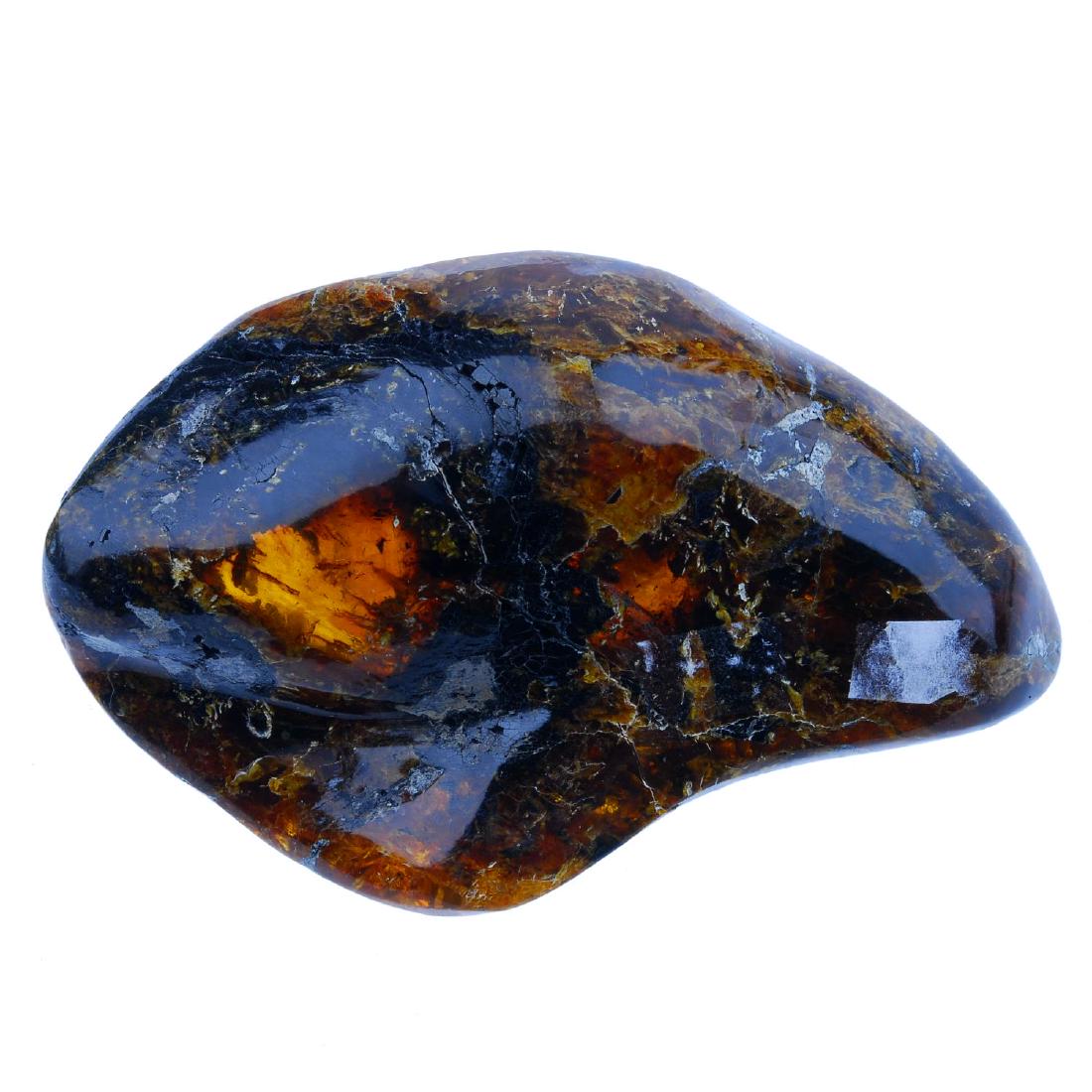 A piece of natural Dominican Republic amber. The: A piece of natural Dominican Republic amber. The polished piece of amber measuring 7.4 by 12cms. Weight 156.7gms.