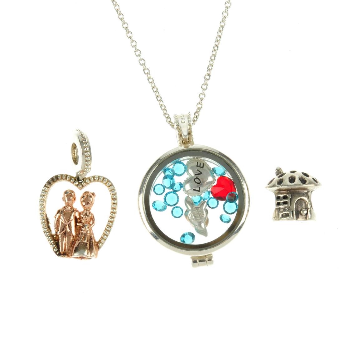 A selection of designer jewellery and charms. To: A selection of designer jewellery and charms. To include two Chamilia charm bracelets, one with two charms, a Lovelinks charm ring, four Pandora charms and a selection of nine further charms. Lengths