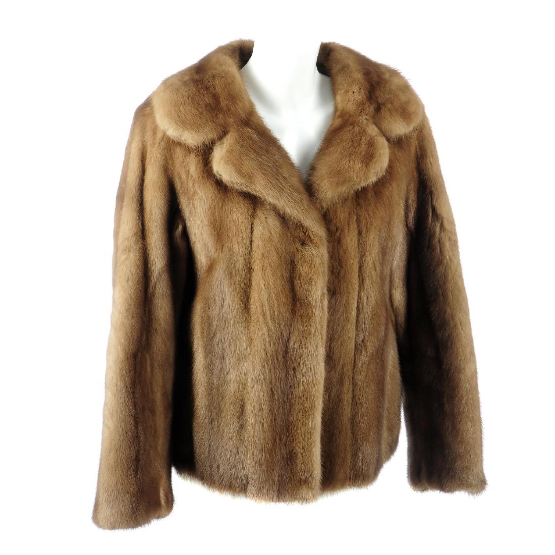 A demi buff mink jacket. Featuring a notched lapel (1 of 2)