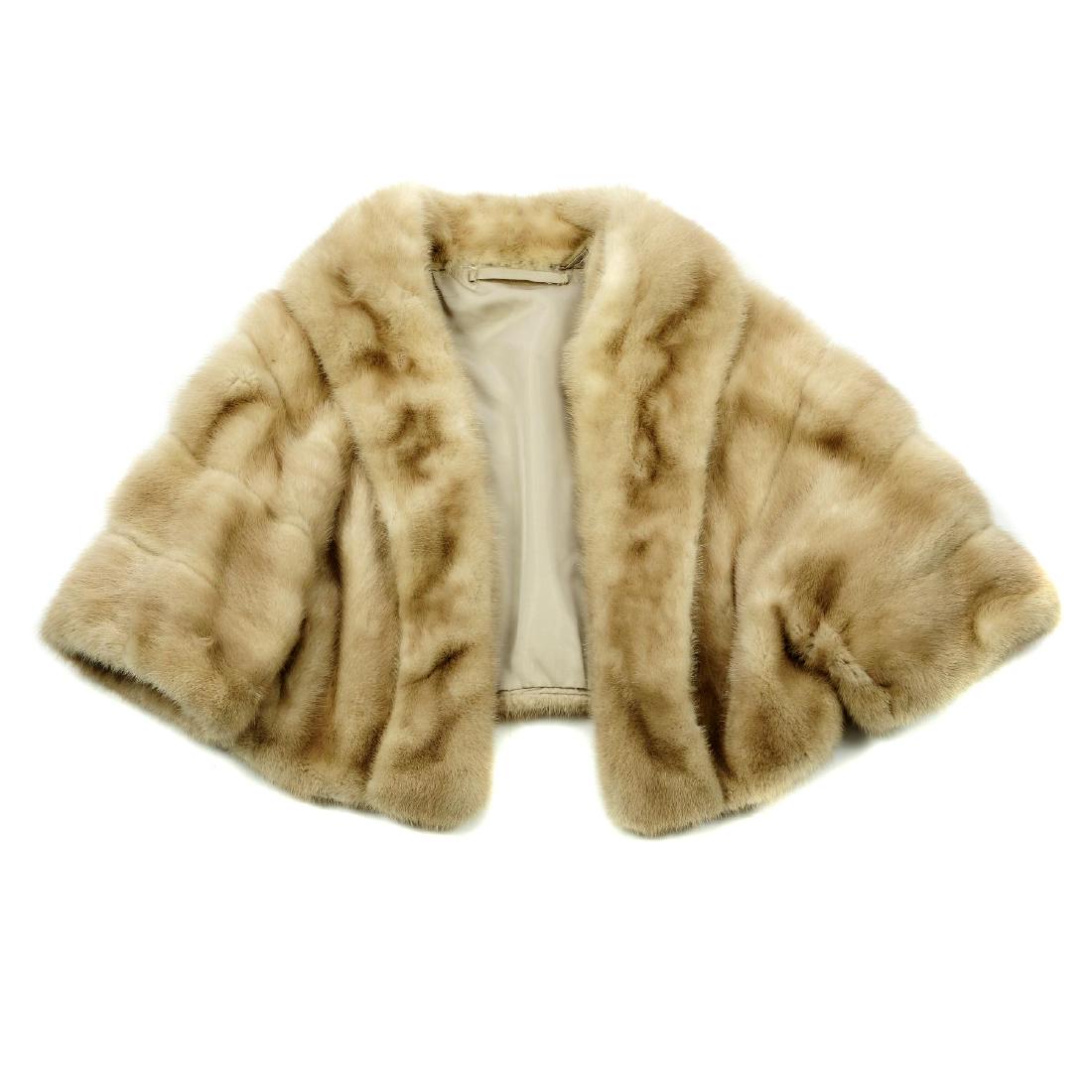 A palomino mink bolero. Featuring a shawl collar, an: A palomino mink bolero. Featuring a shawl collar, an open-front design and elbow length sleeves. Believed to fit size 10-14.