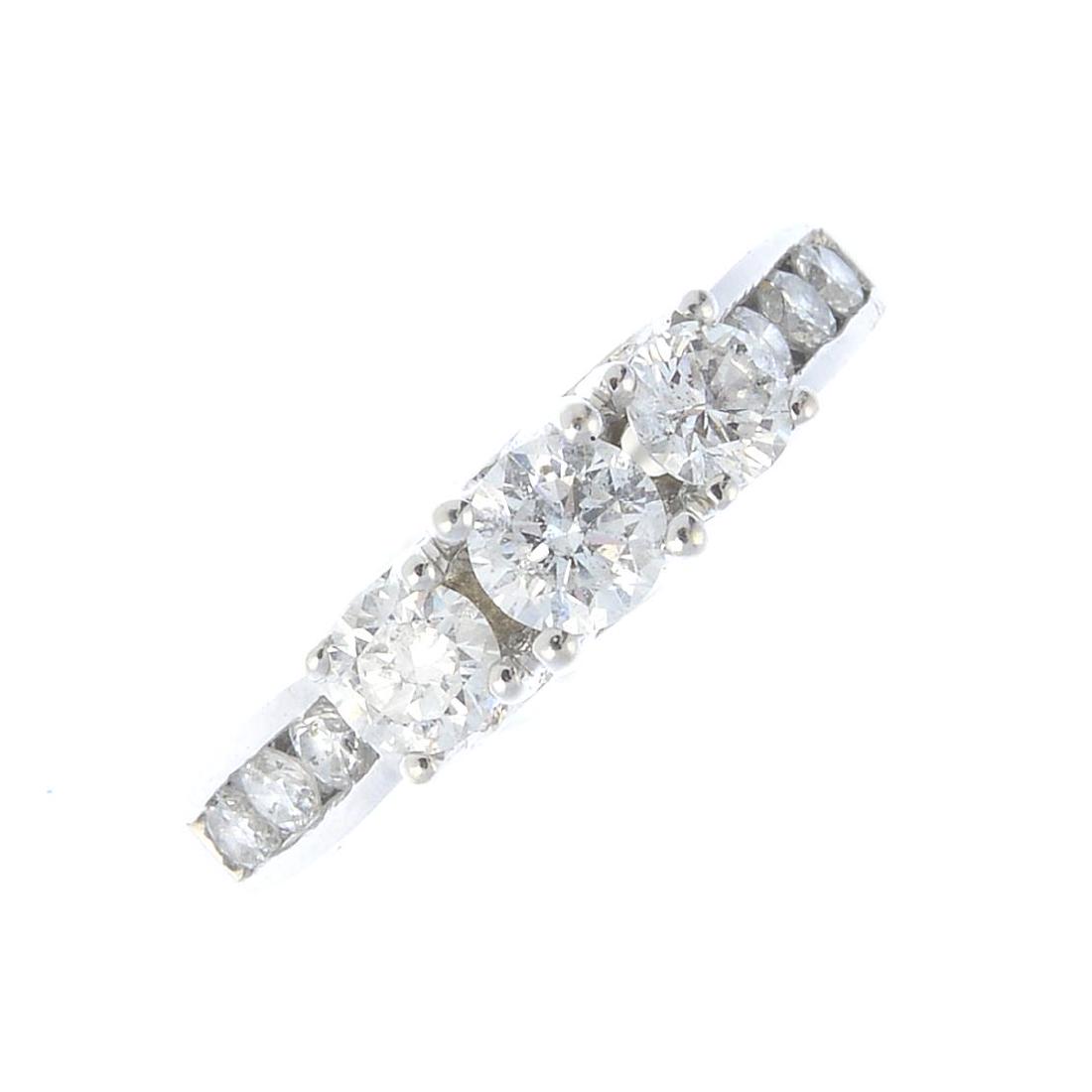 An 18ct gold diamond three-stone ring. The graduated (1 of 3)