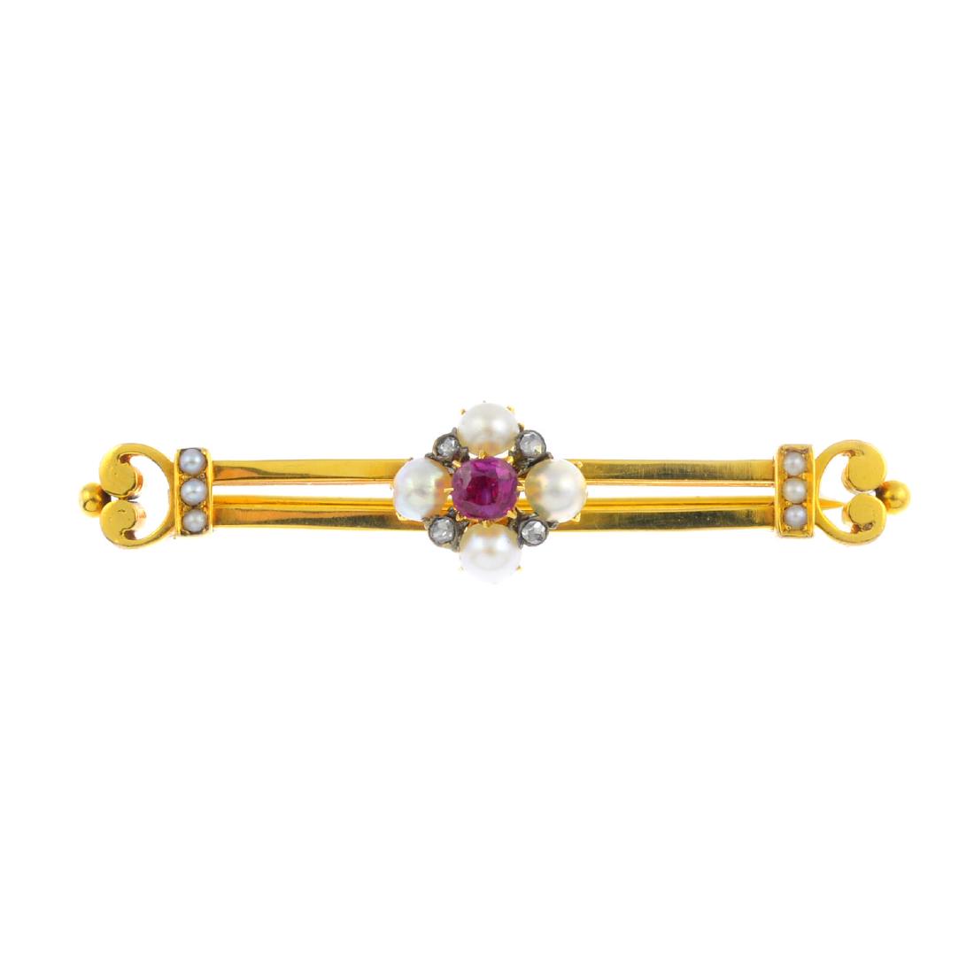 An early 20th century gold ruby, split pearl and (1 of 2)