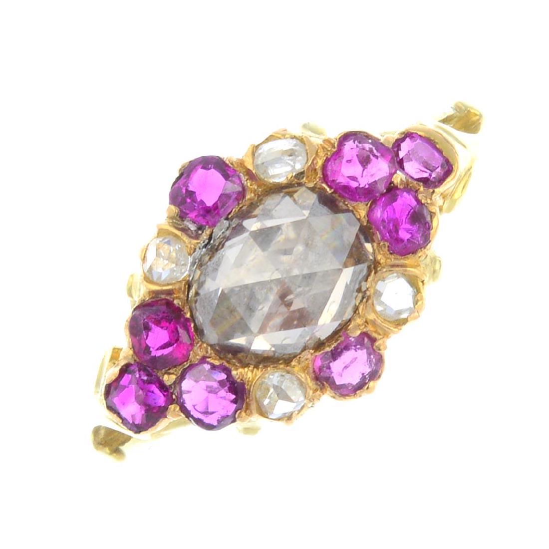 A diamond and ruby cluster ring. The rose-cut diamond, (1 of 3)