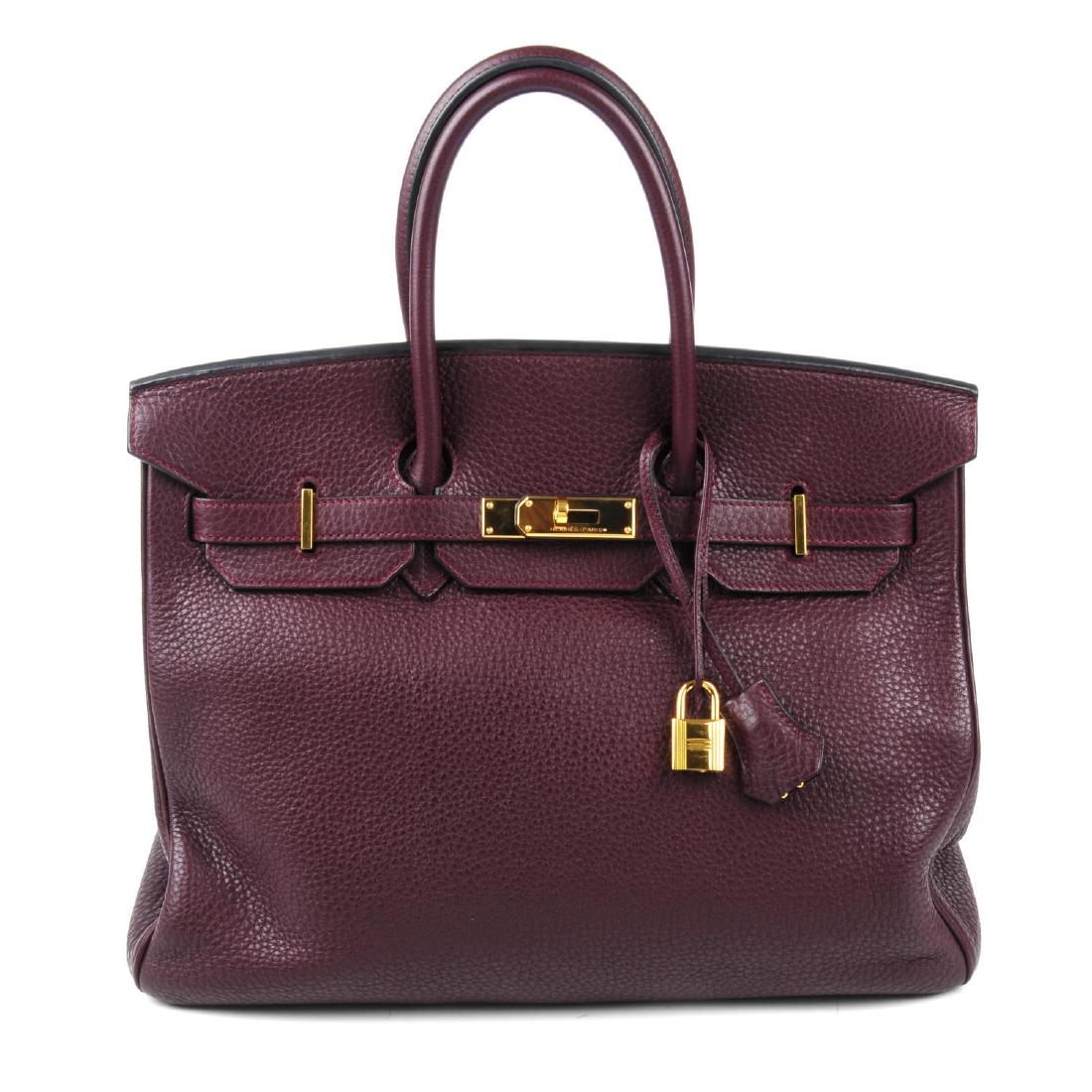 HERMÈS - a plum Clemence Birkin 35 handbag. Designed (1 of 4)