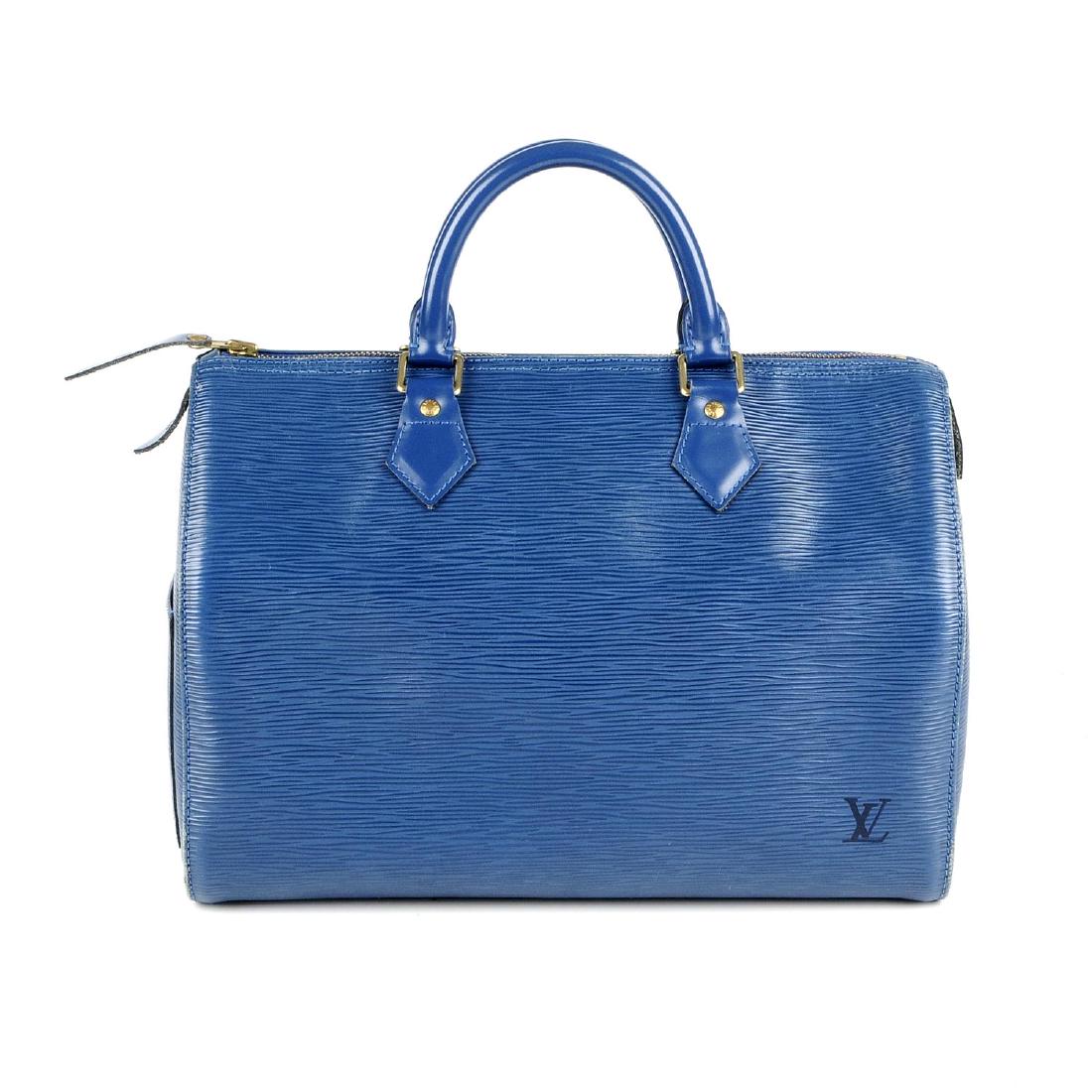 LOUIS VUITTON - a blue Epi Speedy 30 handbag. Designed: LOUIS VUITTON - a blue Epi Speedy 30 handbag. Designed with maker's blue textured epi leather exterior with smooth leather trim, with a patch pocket to one side, double rolled leather handles, top zip
