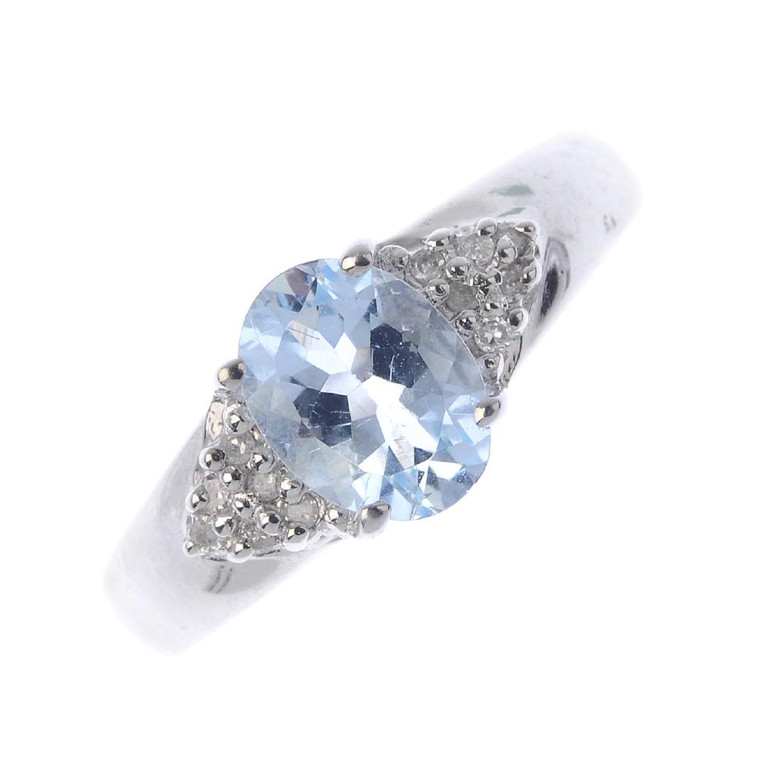 A 9ct gold diamond and aquamarine ring. The oval-shape (1 of 1)