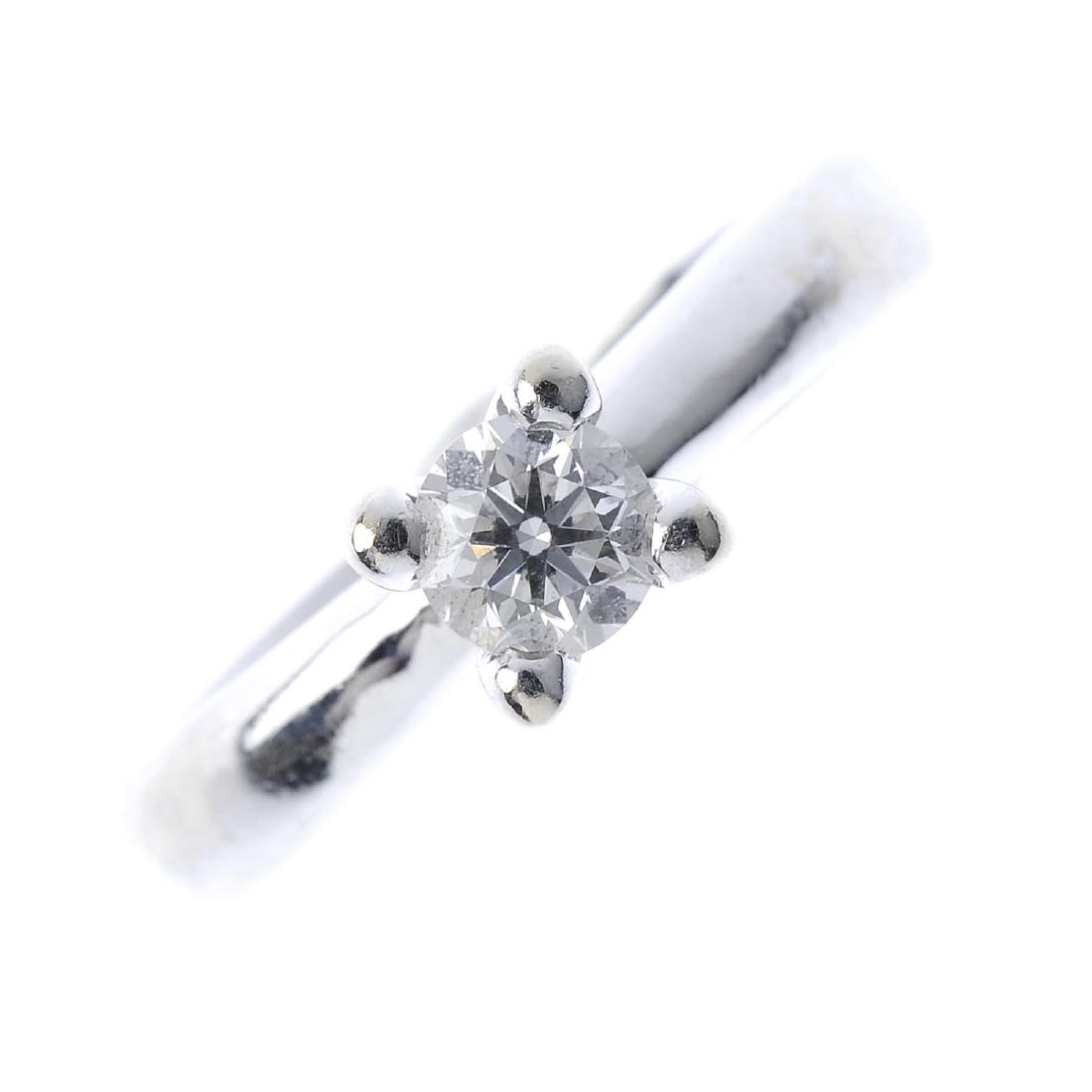 A diamond single-stone ring. The brilliant-cut diamond, (1 of 3)